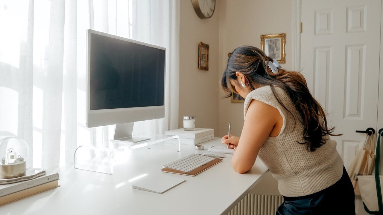 Modern home office setup with Apple iMac, keyboard, and tech accessories.
